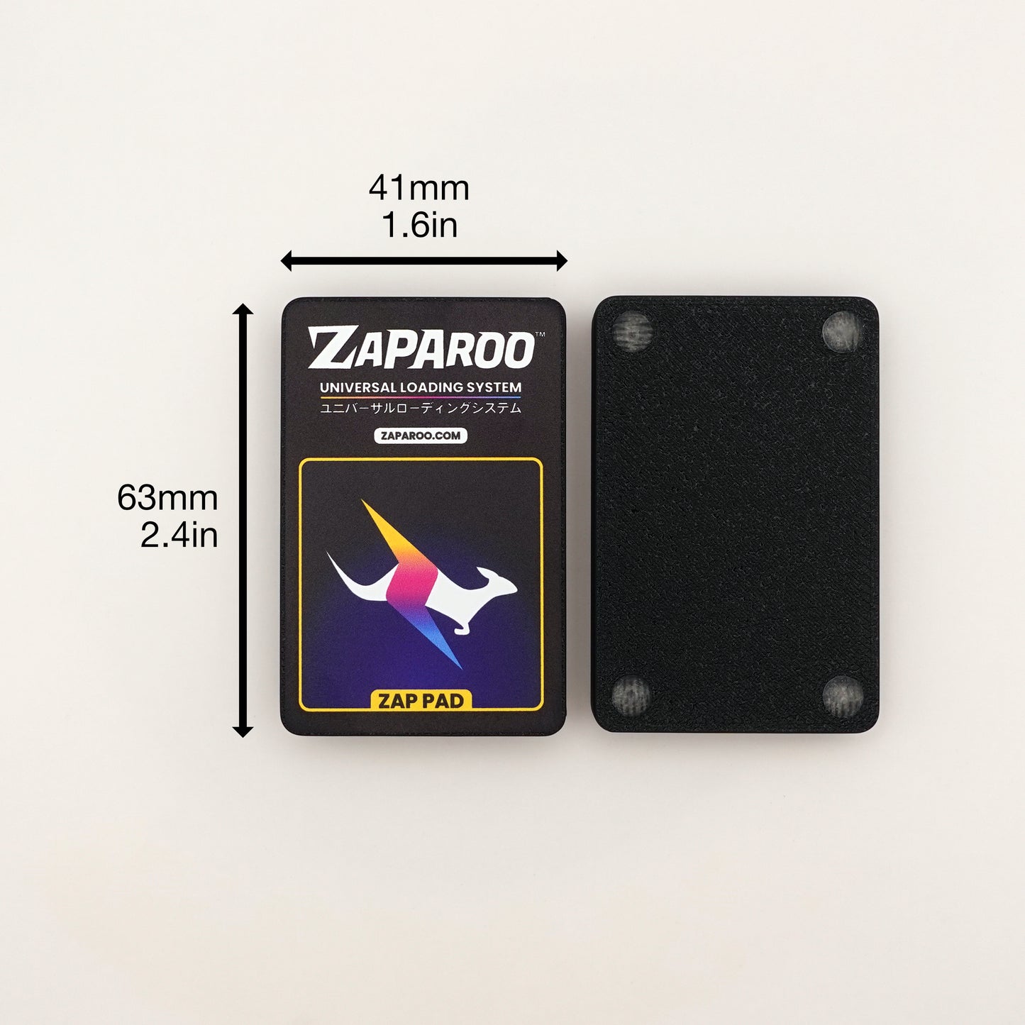 Top down shot of two Black Zap Pads. One showing the top, the other flipped over upside down with rubber feet visible. Dimensions are shown as 41mm/1.6in width and 63mm/2.4in height.
