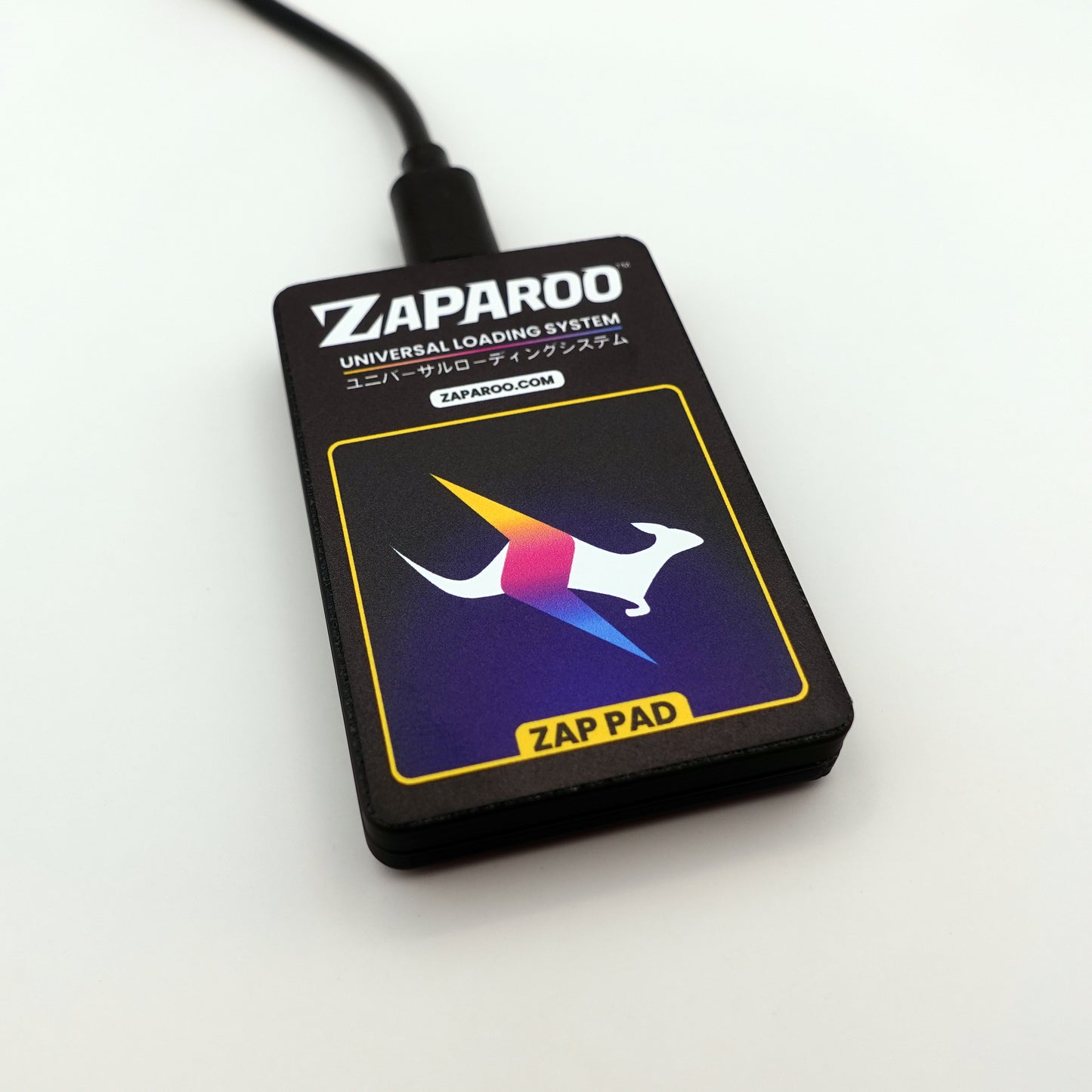 Close up front shot of black Zap Pad with USB cable plugged in.